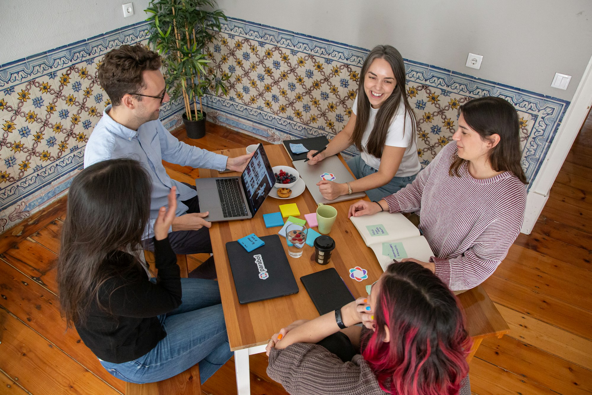 UniversalAI.Tech automation engineers collaborating at a workbench